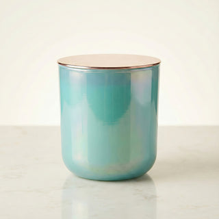 Shimmering Sea – Staycation ocean-inspired premium coconut apricot wax candle in radiant iridescent turquoise glass vessel topped with elegant rose gold lid