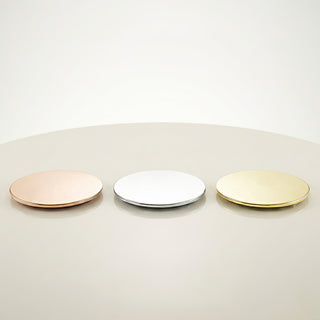 Luxury rose gold, silver, and gold metal lids for GLORY STRENGTH candle collection on marble surface