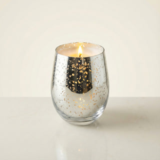 Legacy Collection Today flagship luxury candle lit with golden flame in mirror silver mercury glass vessel