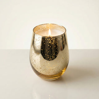 Legacy Collection Tomorrow flagship luxury candle lit with golden flame in gold mercury glass vessel