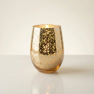 Legacy Collection Tomorrow flagship luxury candle burning with deep golden flame in gold mercury glass vessel