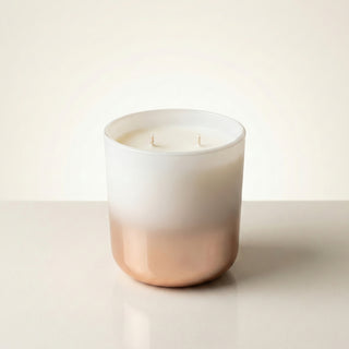 Wistful Starlight Twilight Reverie luxury candle in soft white-to-rose gold ombré glass vessel on clean white background