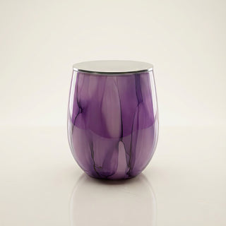 Enigmatic Bloom Feng Shui wood element luxury candle in hand-painted purple marbled glass with polished silver lid