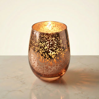 Legacy Collection Yesterday flagship luxury candle burning with deep golden flame in rose-gold mercury glass vessel